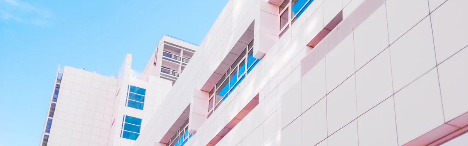 a white modern architectural condominium building